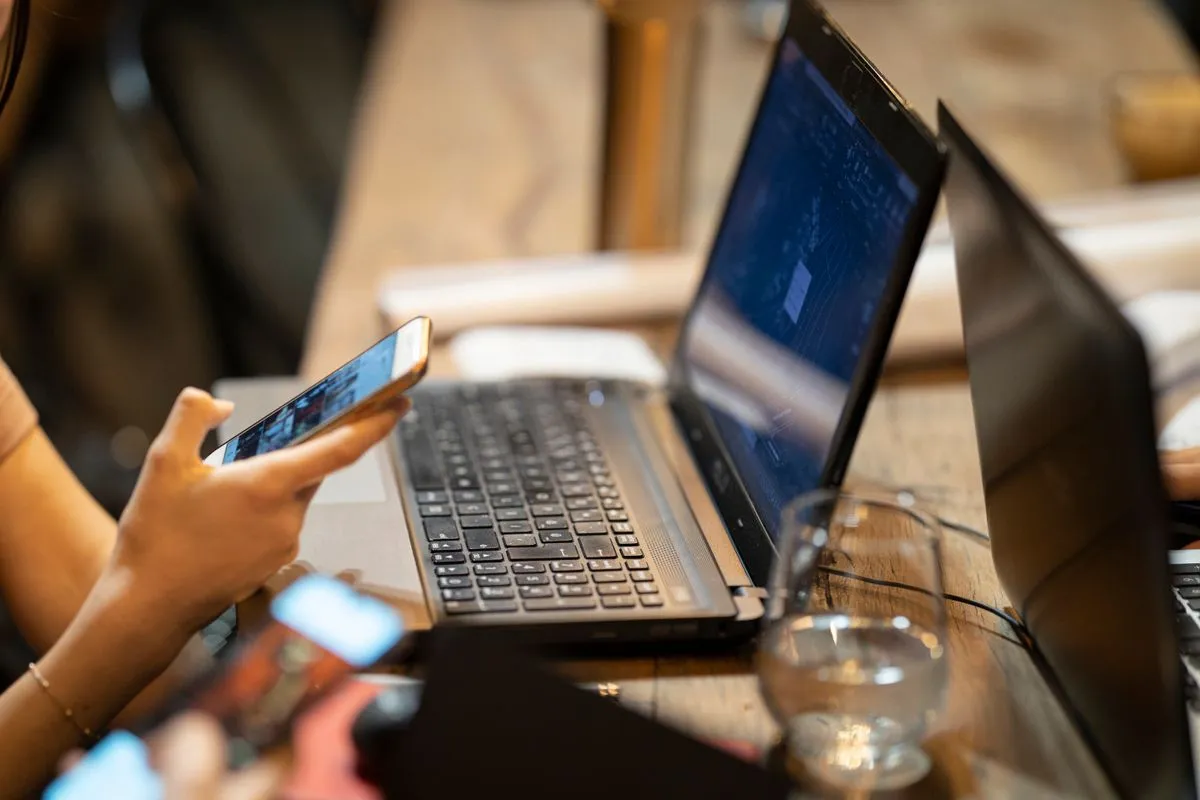 Applying for a cash advance in Canada on a laptop and phone