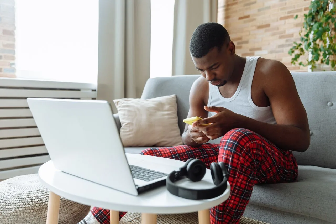 Comparing same-day loans on a smartphone at home in Canada