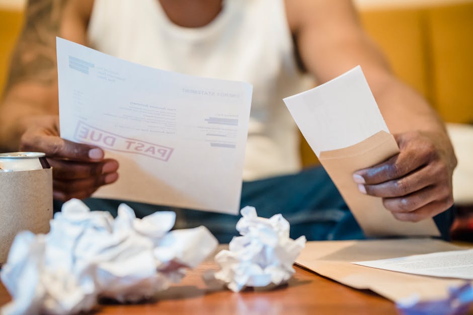 Man reviewing past due bills needing emergency cash loan Canada