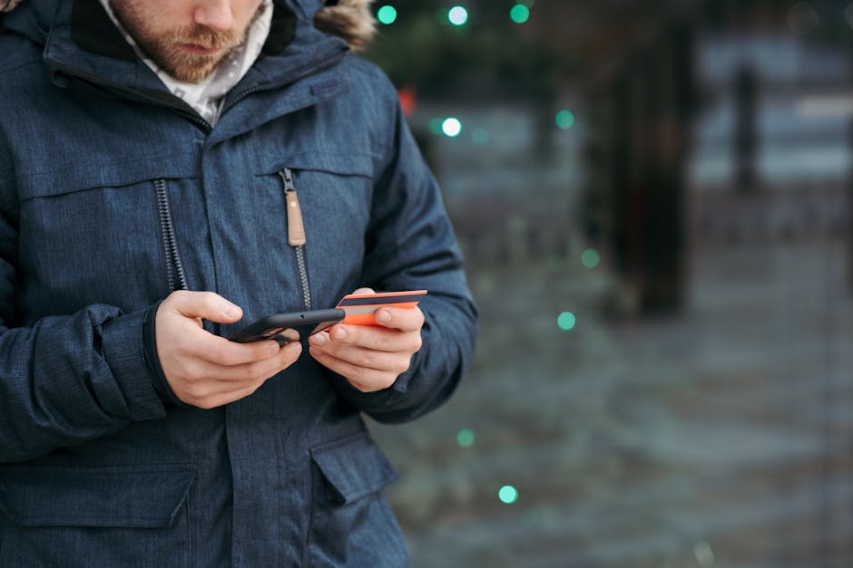 Person entering credit card details on smartphone - apply for rapid cash loan Canada