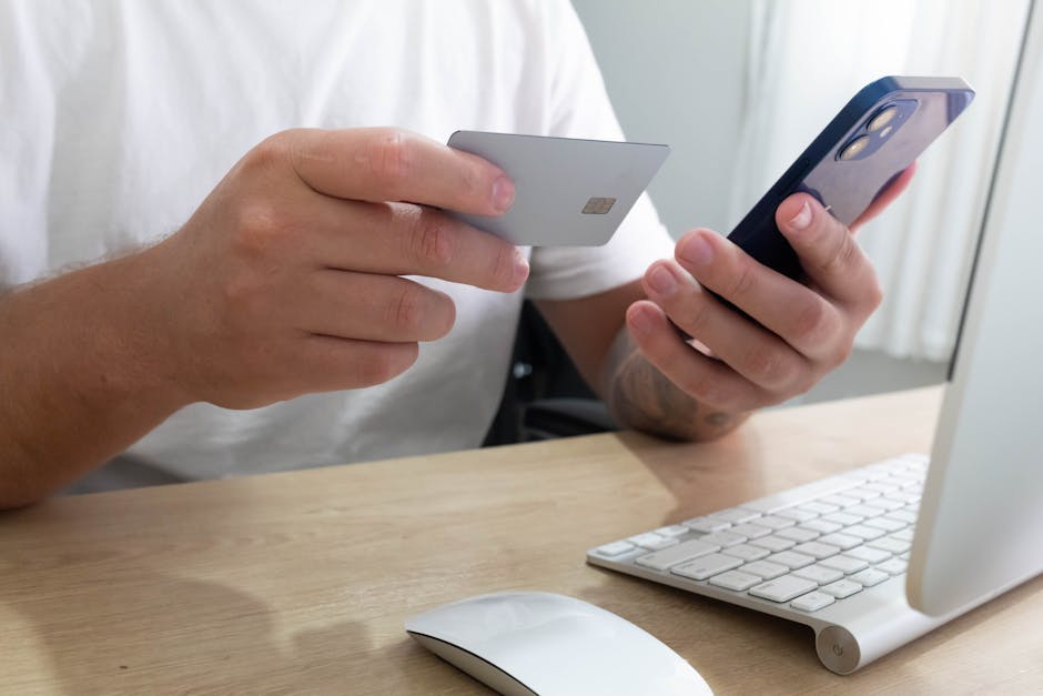 Person with credit card and smartphone applying for  cash loan Canada