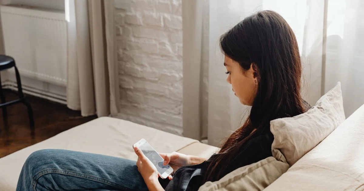 Applying for emergency dental loans from a phone at home