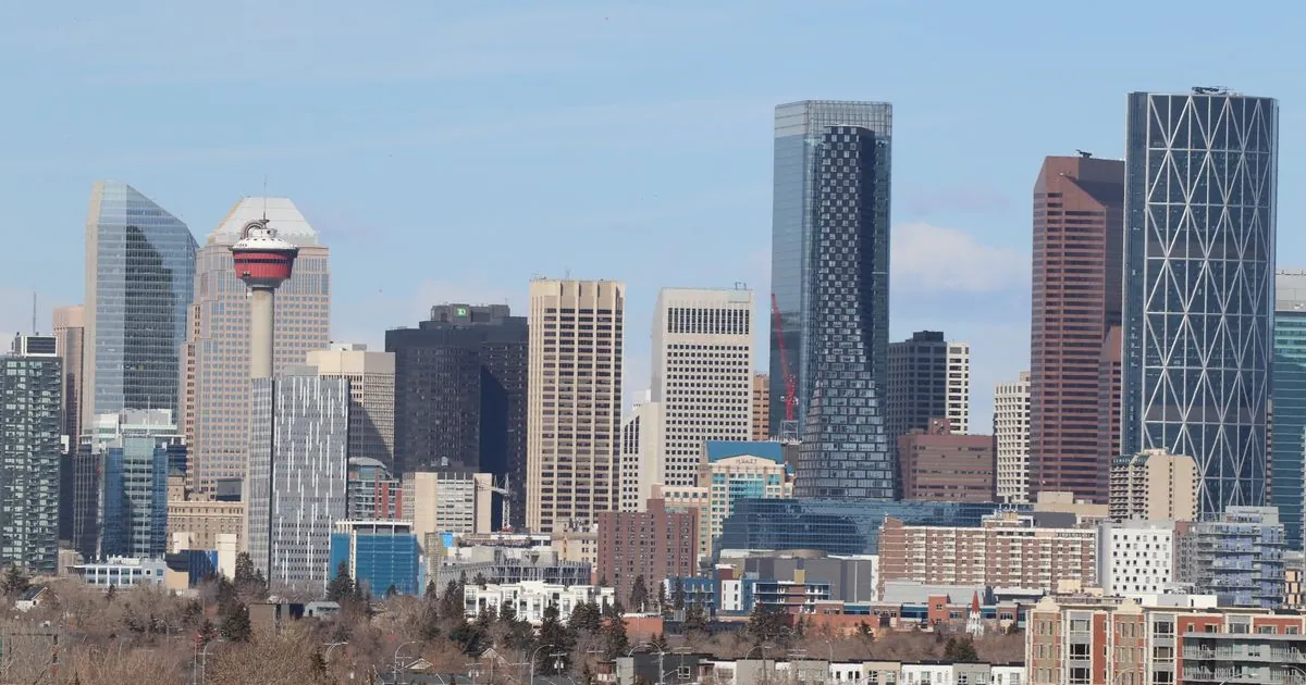Cash advance Alberta borrowers apply for online, with the Calgary skyline and Calgary Tower