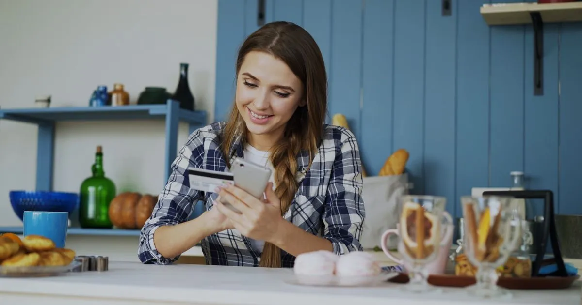 Checking a credit card statement for cash advance fees on a phone
