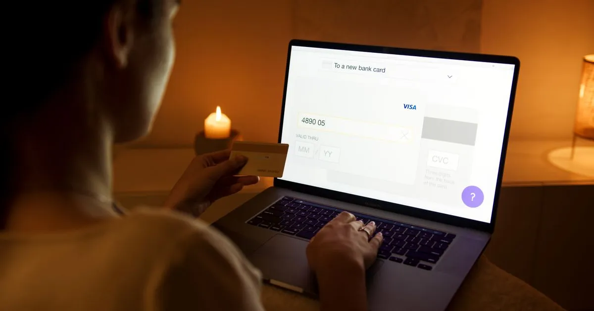 Cash advance fees Canada - reviewing a credit card charge on a laptop