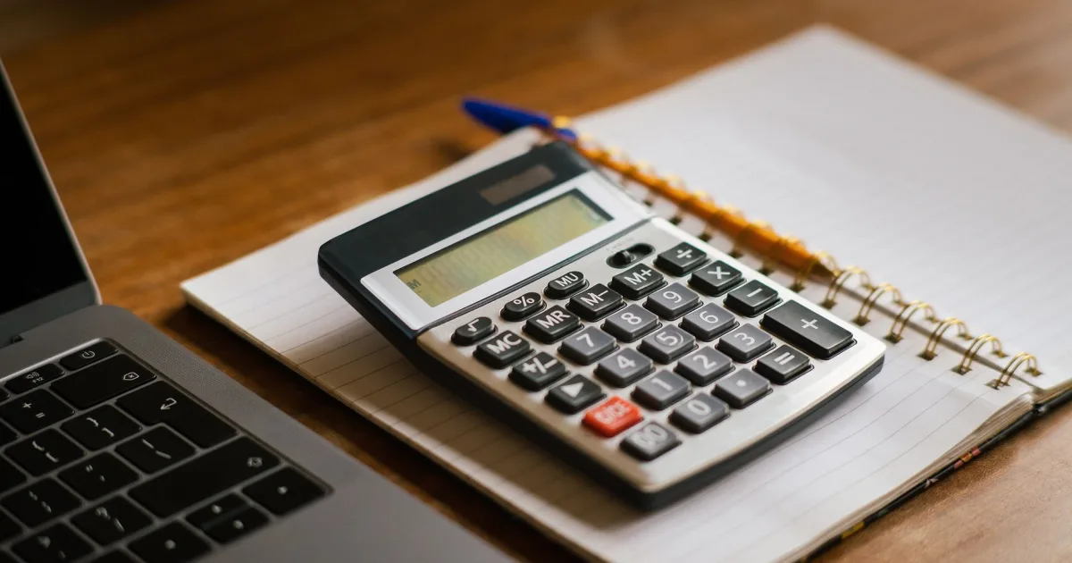 Working out the cost of funeral expense loans with a calculator