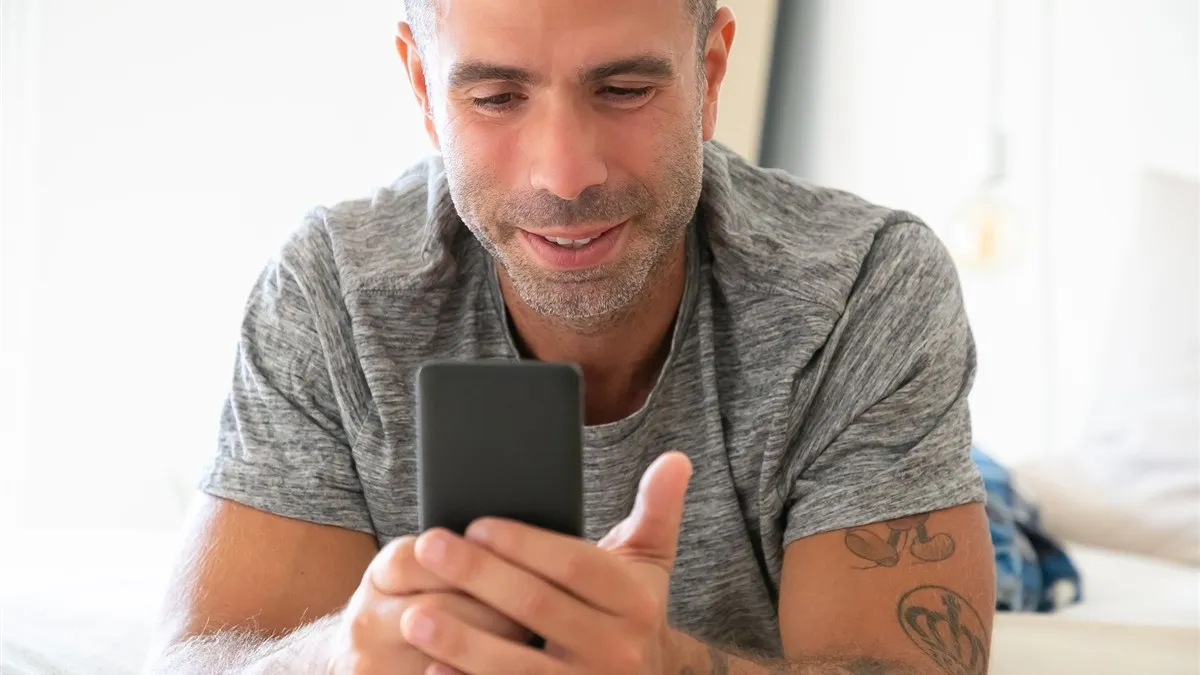 Man applying for medical emergency loans on his phone