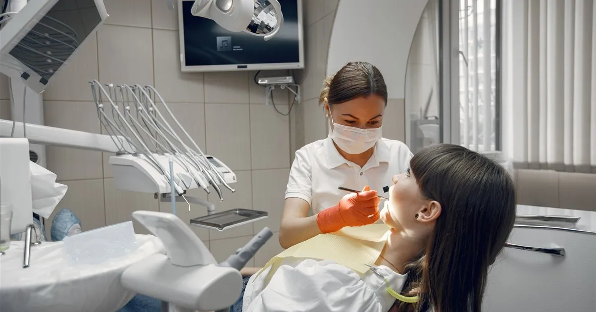 Dentist treating a patient funded by a medical emergency loan in Canada