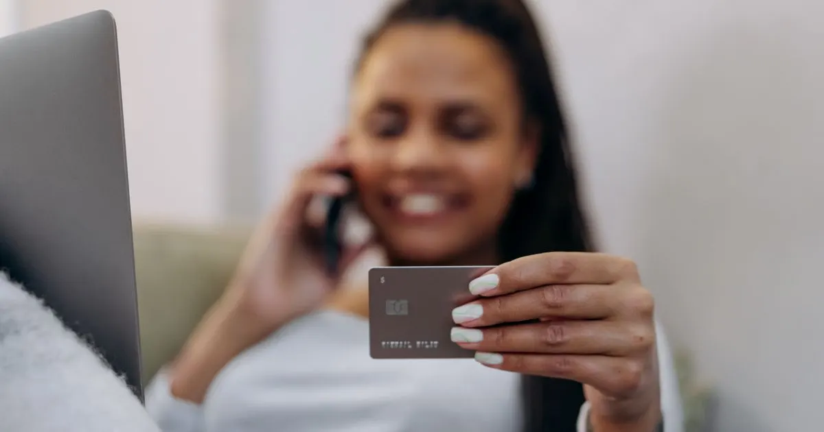 Woman confirming her short term loan arrived by e-Transfer
