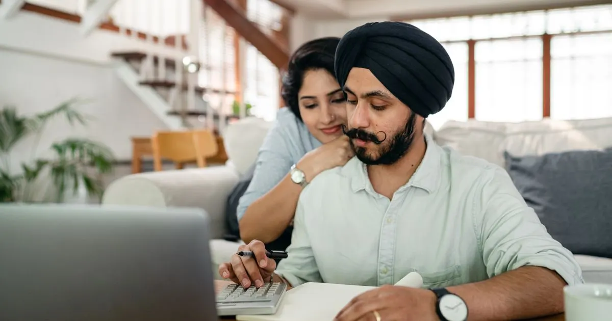 Couple working out a short term loans repayment plan at home