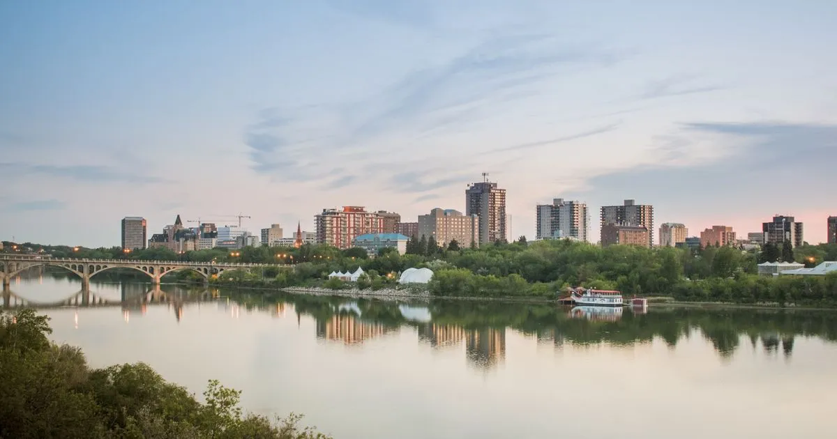Rapid cash loans Saskatchewan borrowers apply for online, with the Saskatoon skyline over the South Saskatchewan River