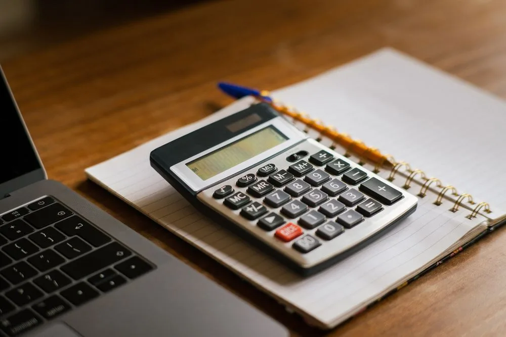 Working out what the Nyble membership costs with a calculator and notebook